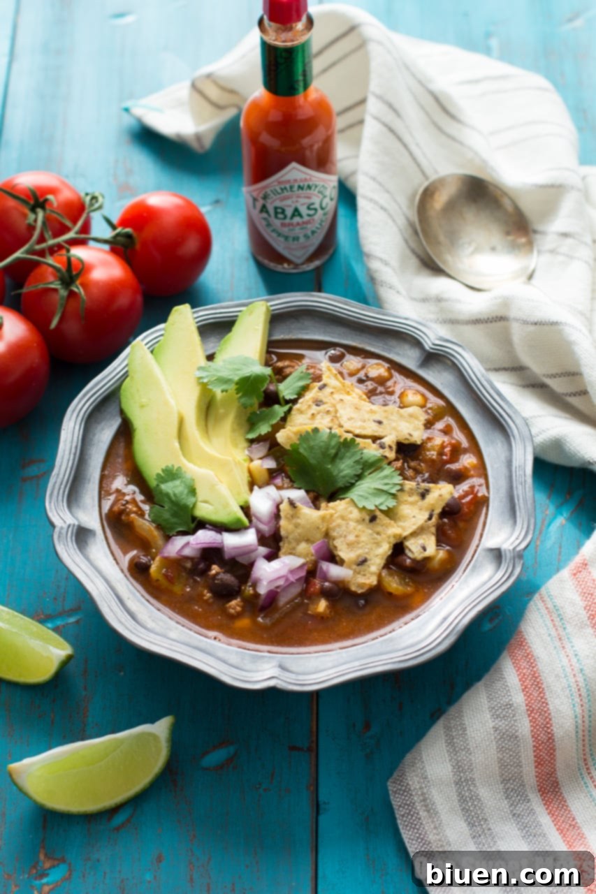 Fully Loaded Chorizo Taco Soup 2 Hearty Chorizo Taco Soup, garnished with fresh toppings