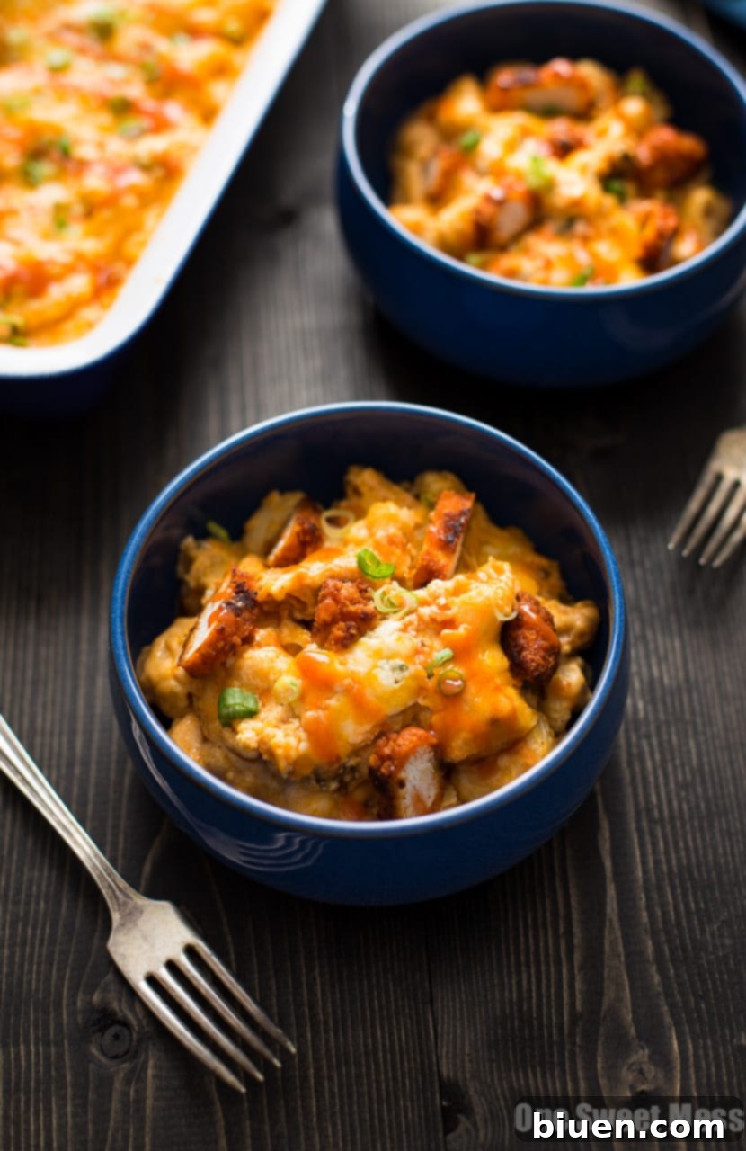 A large serving of Buffalo Chicken Mac and Cheese with a focus on its cheesy texture