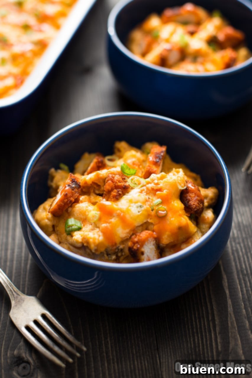 A close-up of the finished Buffalo Chicken Mac and Cheese, showcasing its bubbly and cheesy top