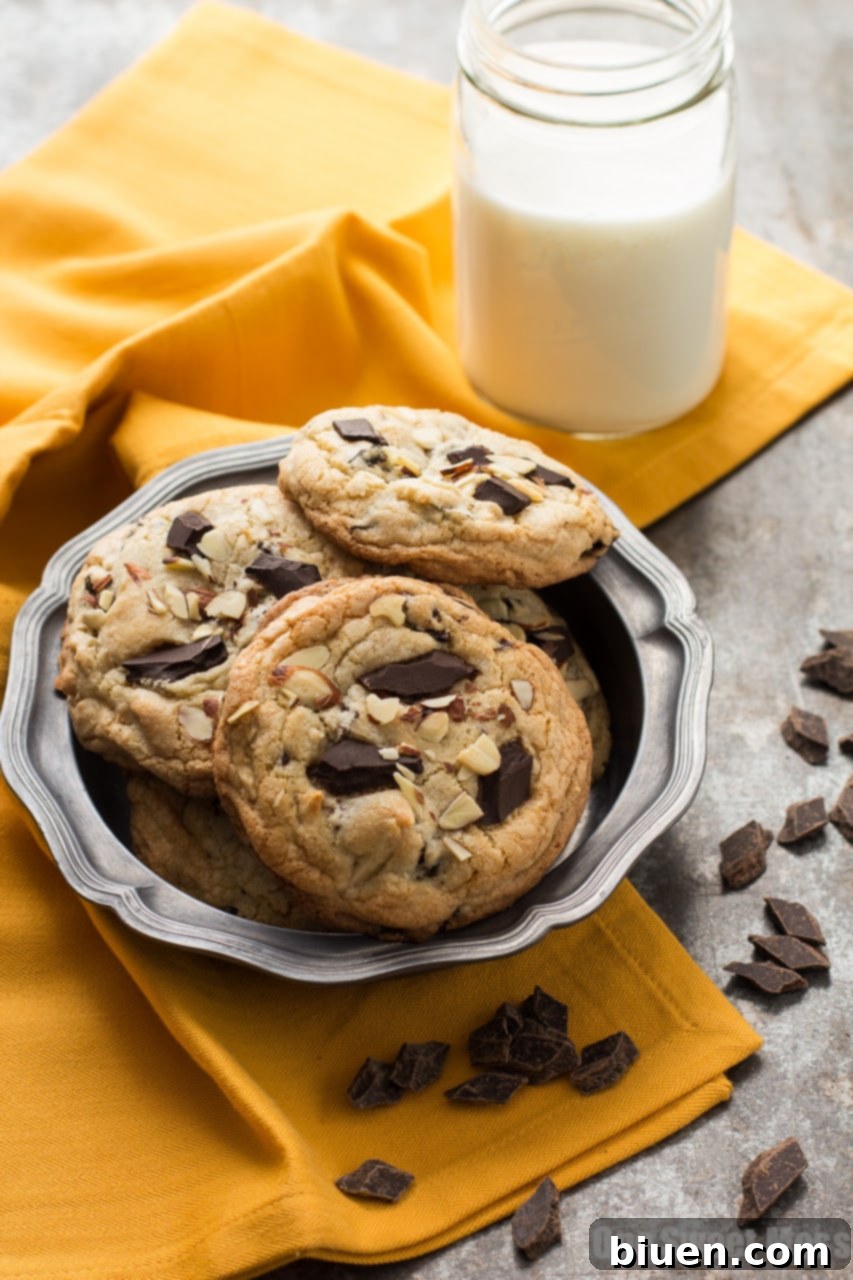 Cherry & Almond Chocolate Chunk Cookies 4 Stack of Cherry Almond Chocolate Chunk Cookies with almonds and chocolate visible