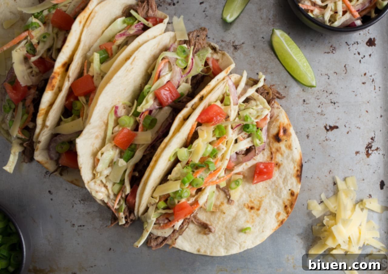 Guinness Shredded Beef Tacos with Mustard Slaw