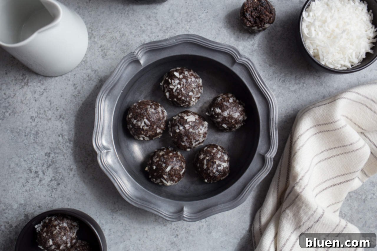 Close-up of freshly made Blueberry Muffin Energy Bites, coated in coconut