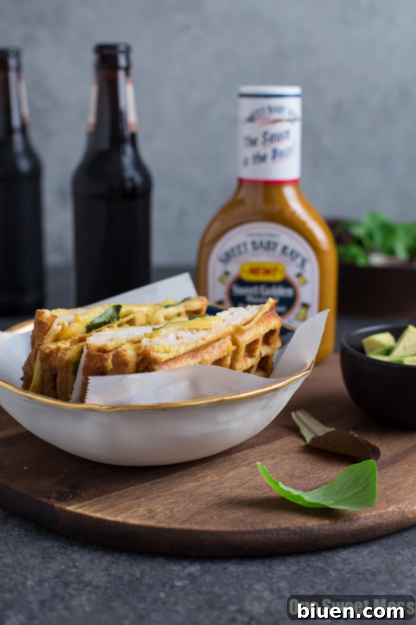 Waffle-Pressed Turkey Smoked Gouda Panini 4 Ingredients for a Waffle Iron Panini, including turkey, gouda, bacon, avocado, and Sweet Baby Ray's sauce