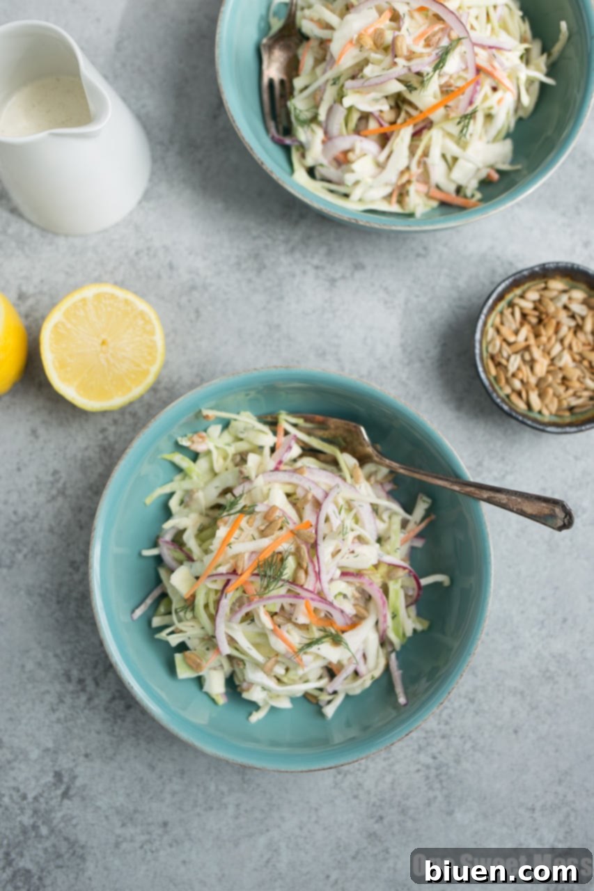 Lemon Dill Coleslaw garnished with fresh dill