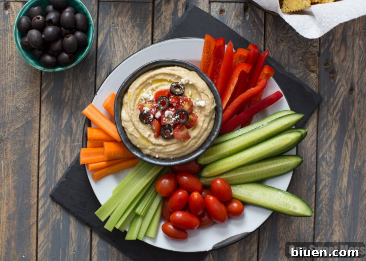 Traditional Greek Hummus Mezze 3 Greek Hummus Platter ingredients ready for assembly on a counter