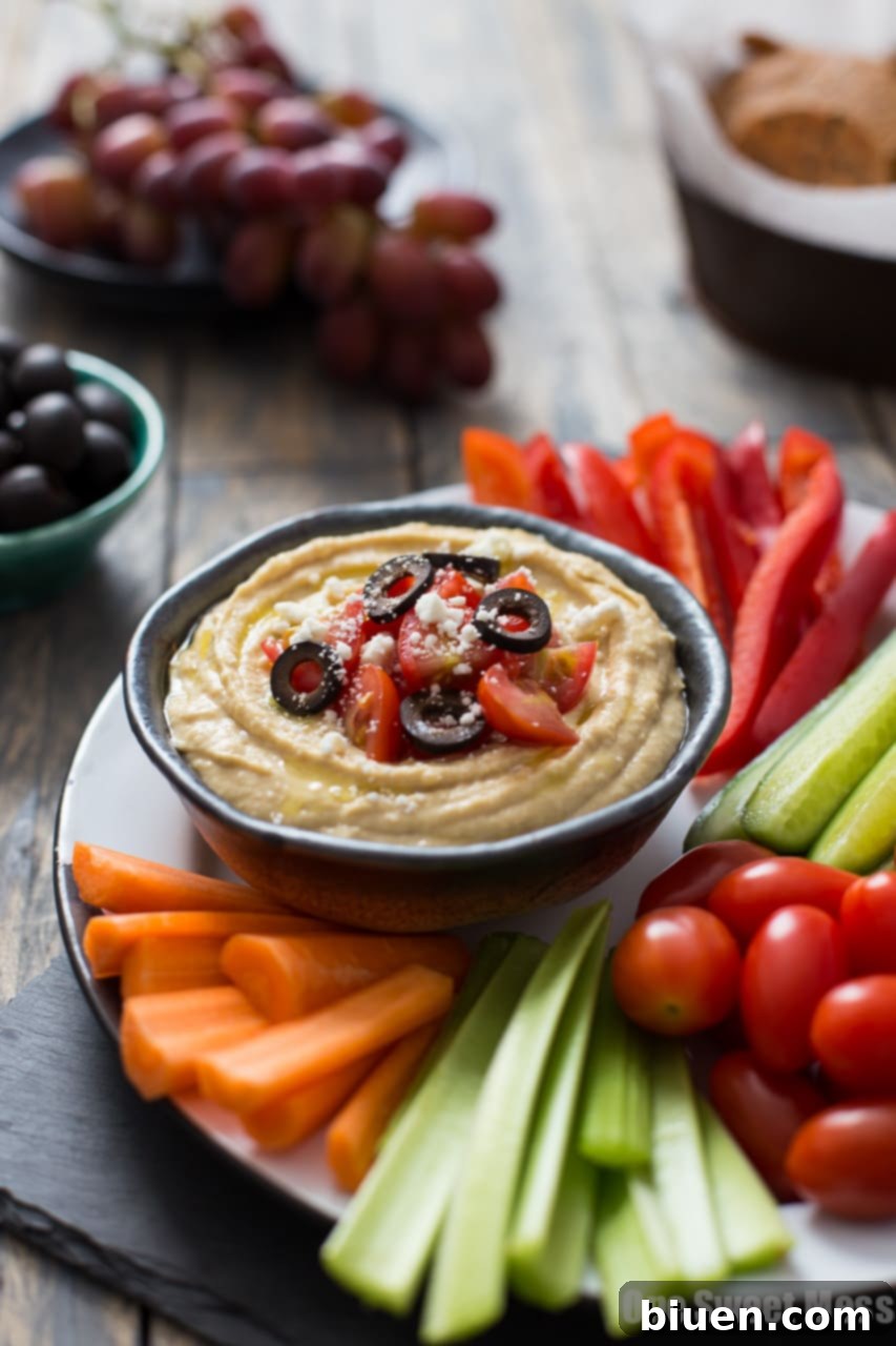 Traditional Greek Hummus Mezze 4 Close-up of Greek Hummus Platter with various fresh vegetable dippers