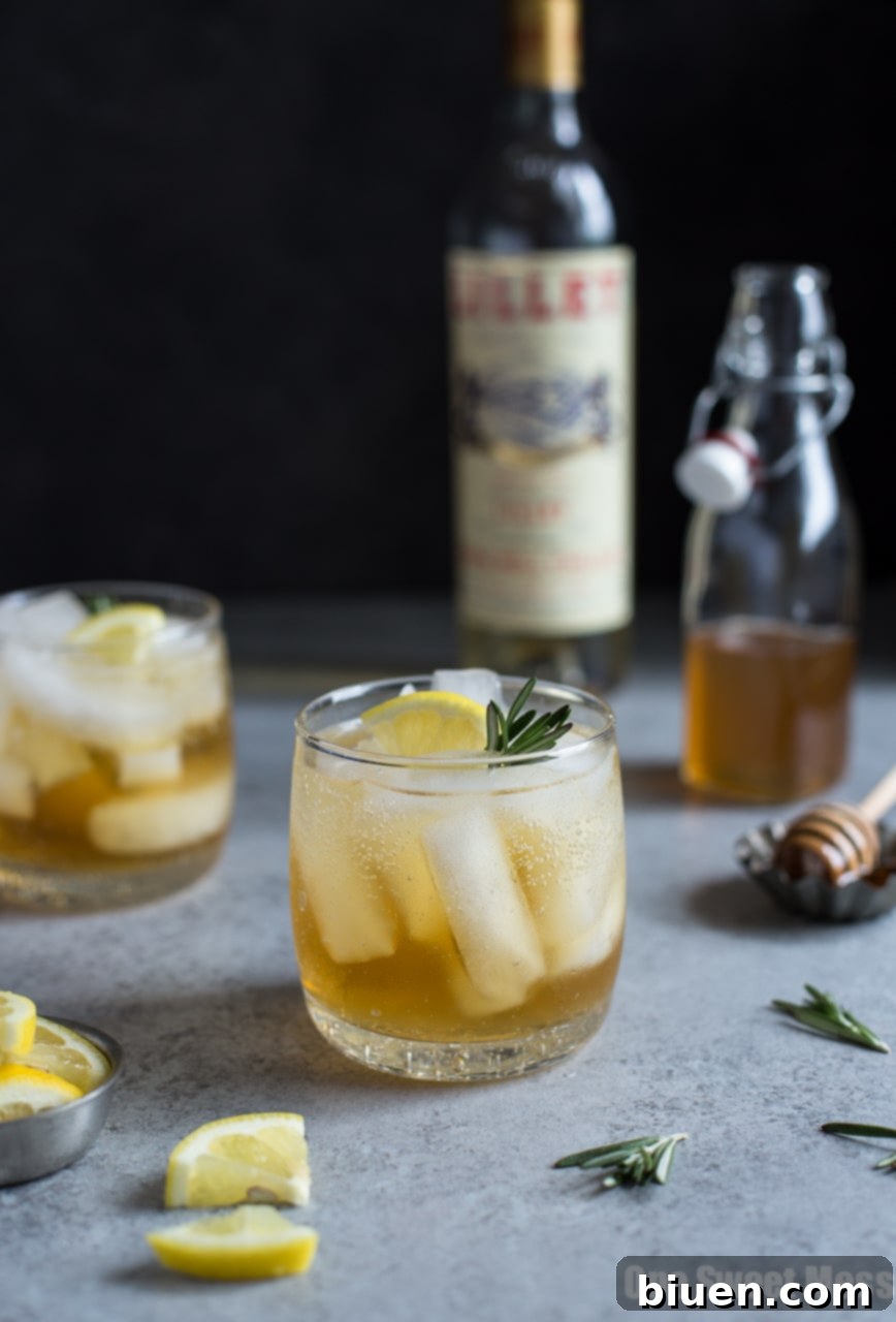 Honey Rosemary Lillet Spritzer, a refreshing summer cocktail