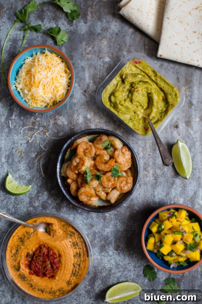 Colorful Shrimp Burrito filling with Mango Salsa and Guacamole