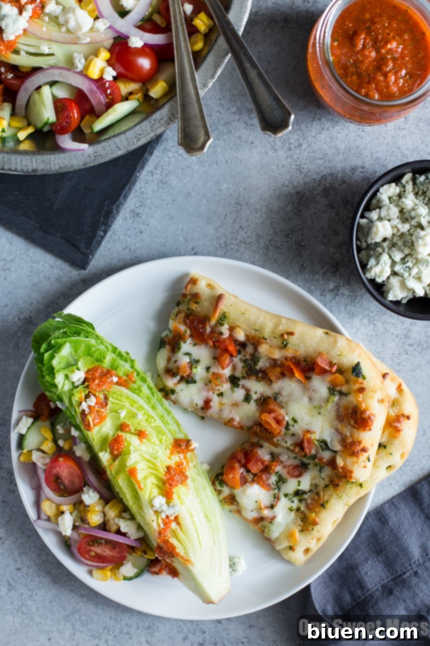 Homemade Roasted Red Pepper Vinaigrette being prepared in a food processor, showcasing its creamy texture