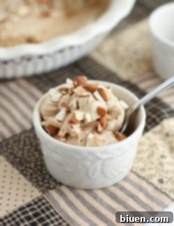 A beautifully presented slice of Espresso & Toasted Almond Semifreddo, showing its layers and toasted almonds.