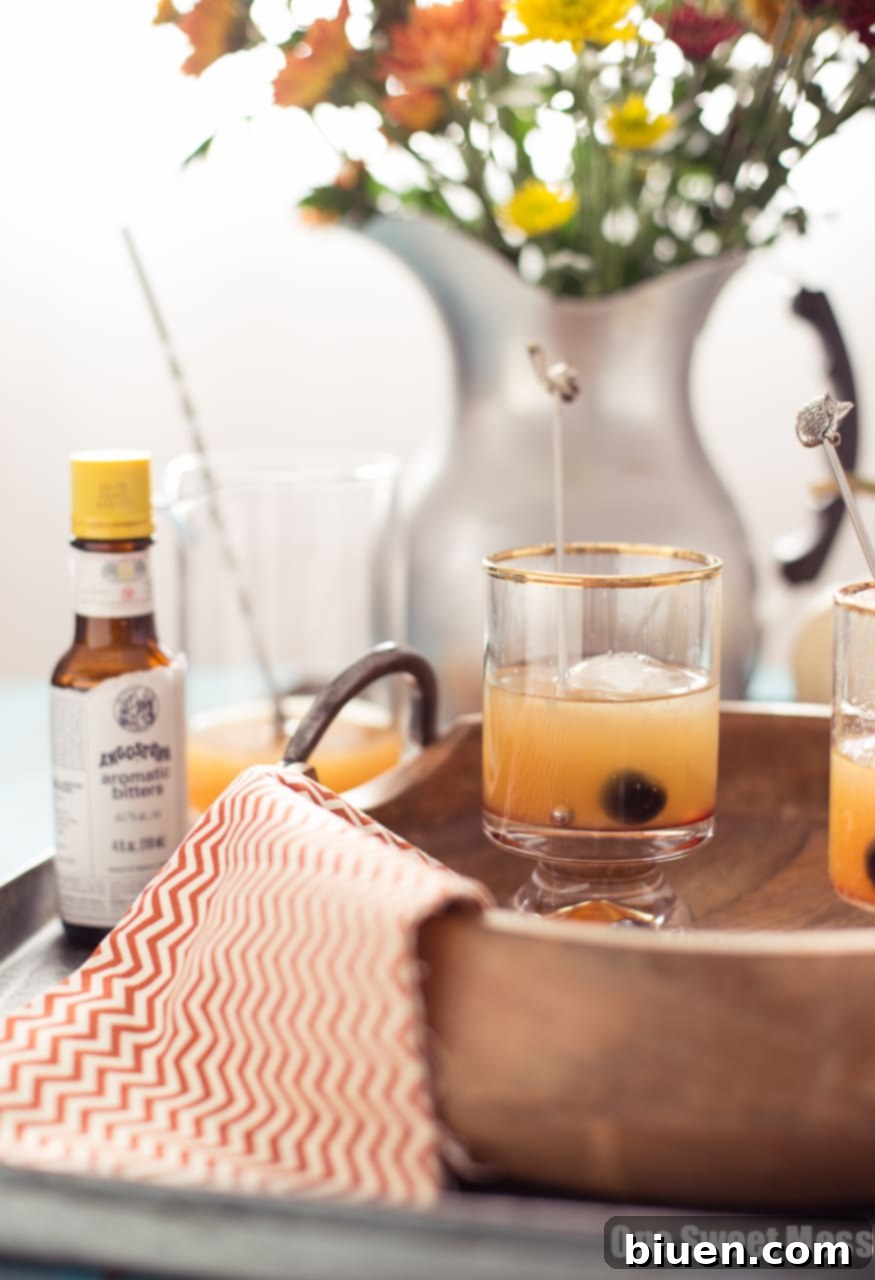 Autumn Spice Rum Old Fashioned 3 Pumpkin Spice Rum Old Fashioned with a warm, inviting glow