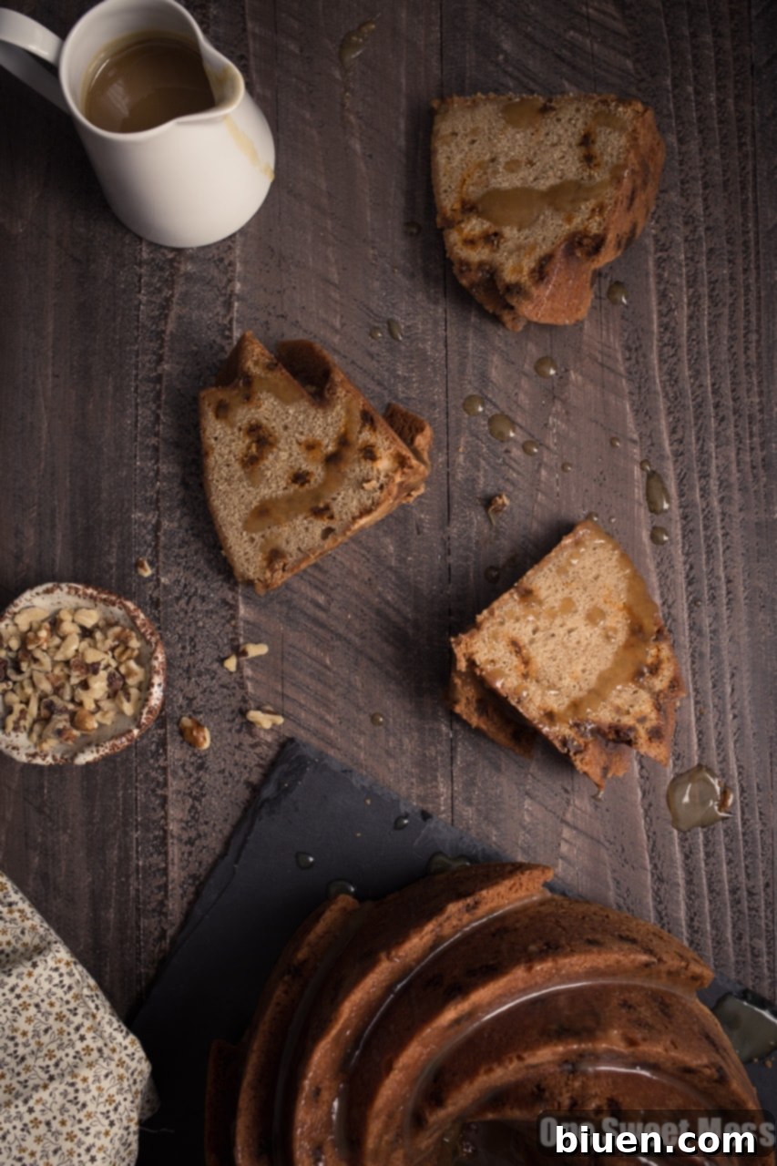 Cinnamon Brown Sugar Bundt Cake with Butterscotch Rum Glaze - Glaze being drizzled over the cake