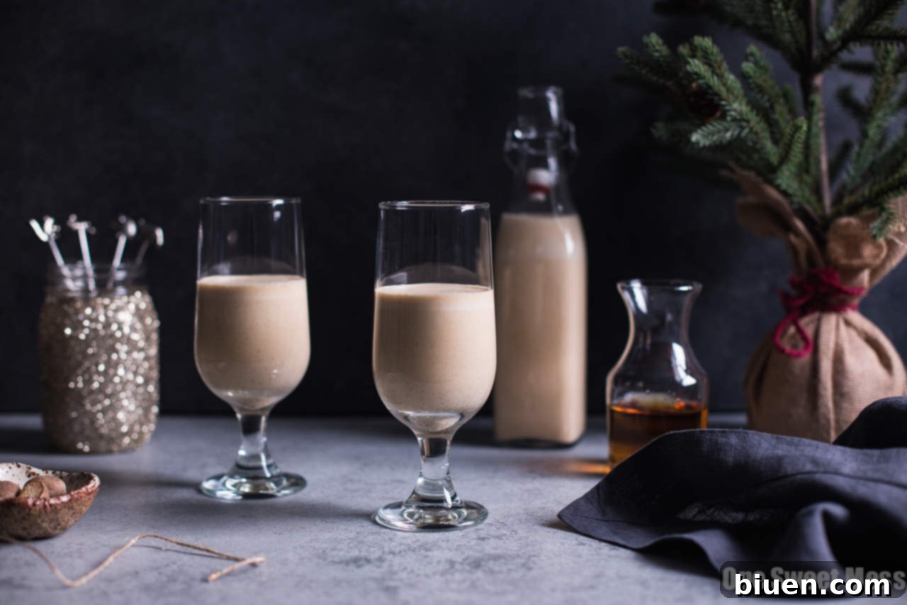Pumpkin Spice Bourbon Eggnog in a glass with garnish