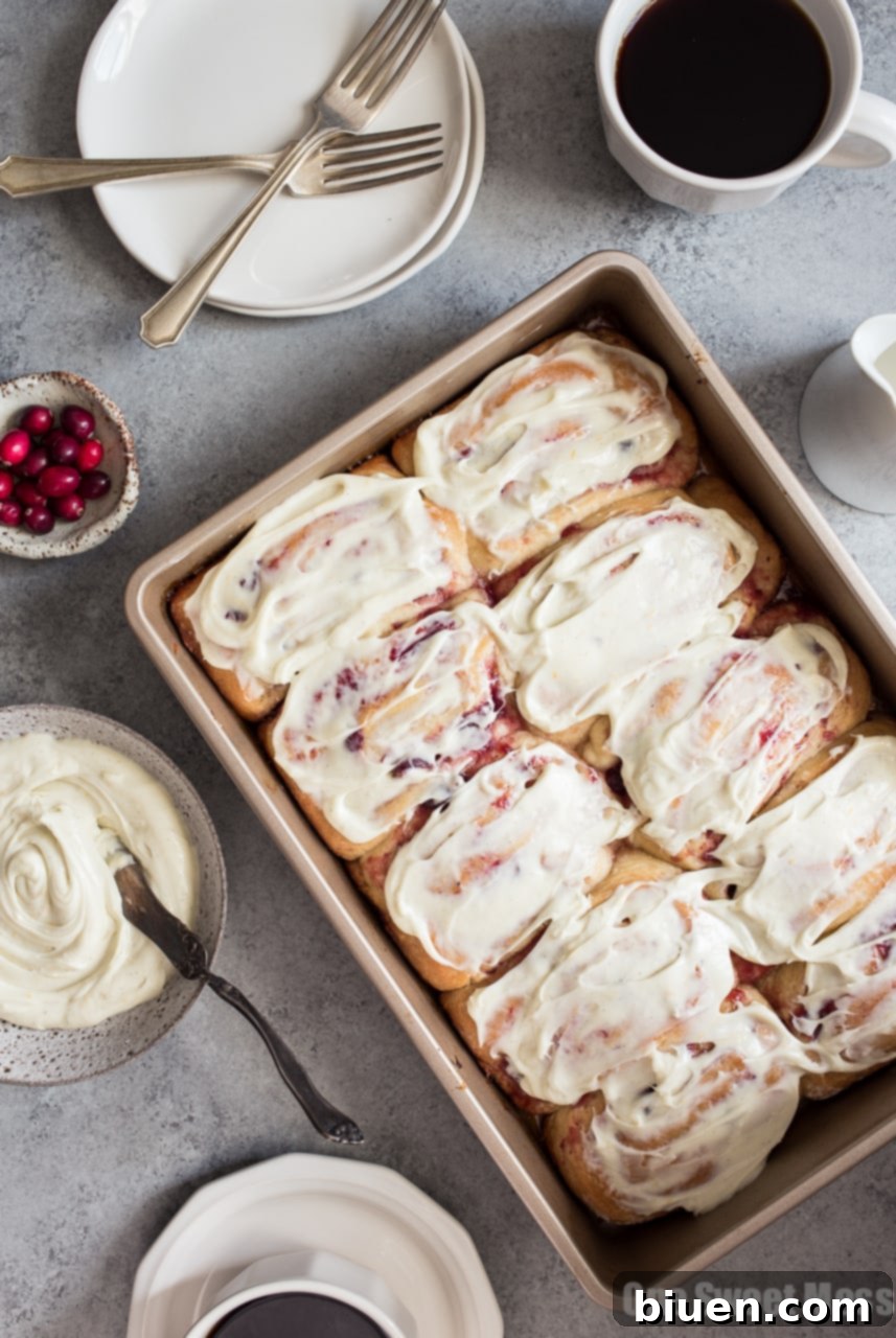 Fluffy Cranberry Orange Sweet Rolls with White Chocolate Cream Cheese Frosting ready to be served