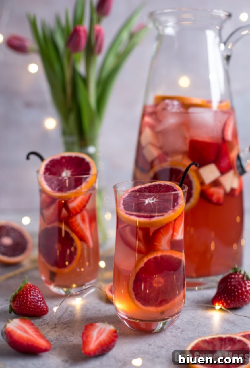 Close-up of Blood Orange Vanilla Bean Rosé Sangria with fruit slices in a glass