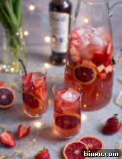Finished Blood Orange Vanilla Bean Rosé Sangria garnished with fresh fruit