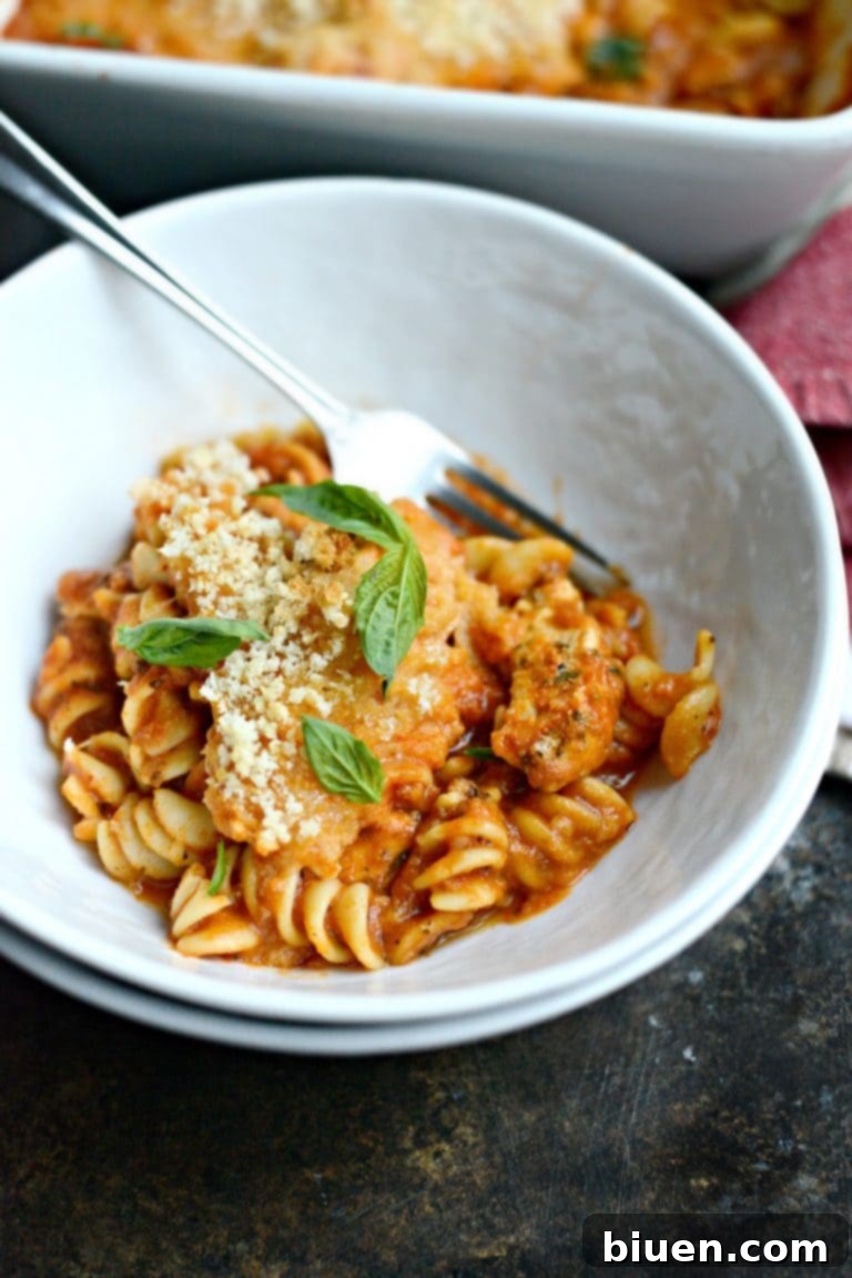 Close-up of a delicious One-Pan Chicken Parmesan Casserole, showcasing melted cheese and savory sauce.