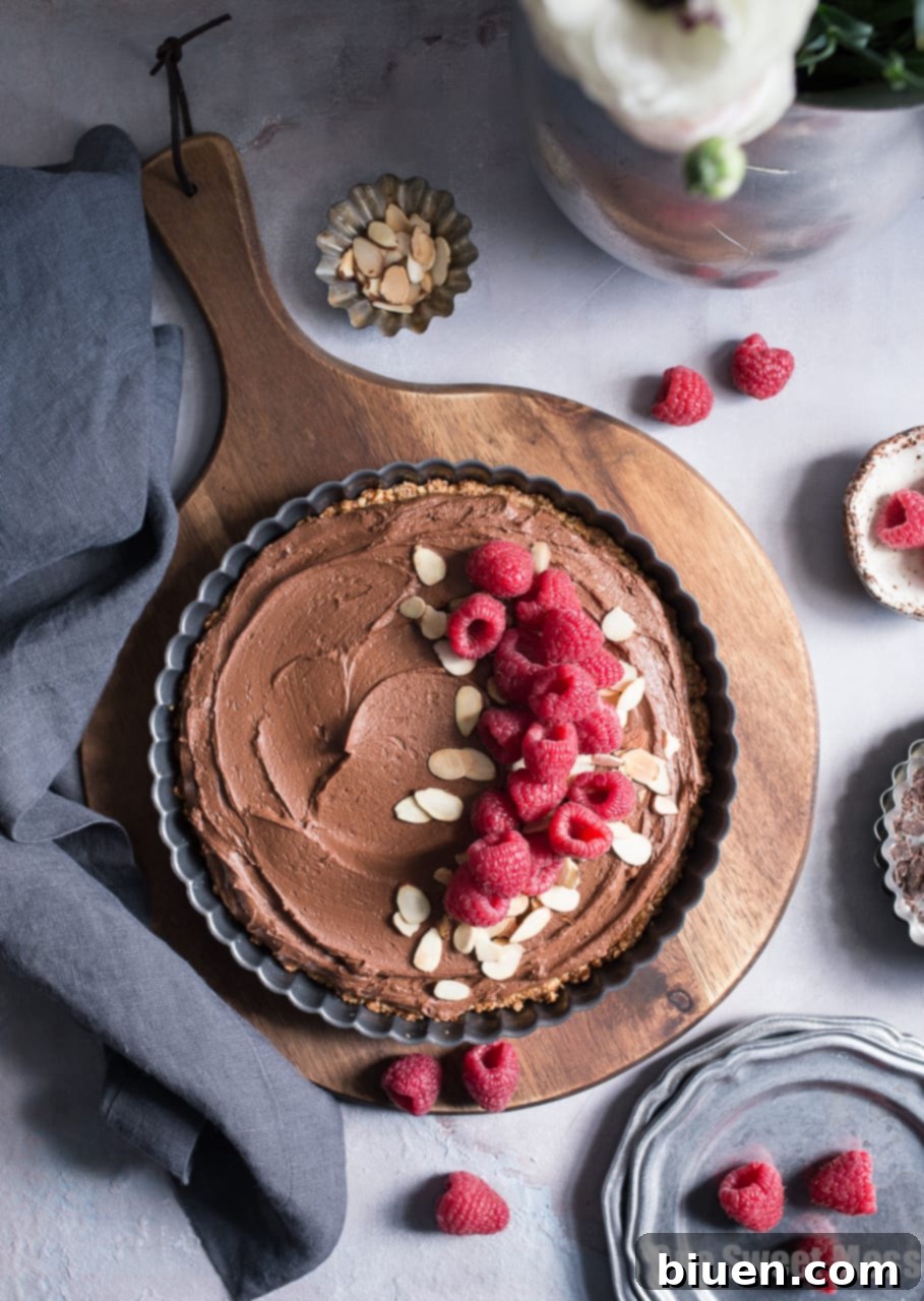 Decadent Vegan Gluten-Free Dark Chocolate Almond Tart 2 Rich, creamy, and ultra chocolate-y Dark Chocolate Almond Tart, perfect for special occasions like Valentine's Day. This decadent dessert is vegan, gluten-free, grain-free, soy-free, and egg-free.