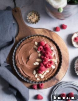 Decadent Vegan Gluten-Free Dark Chocolate Almond Tart 7 Final Dark Chocolate Almond Tart with garnishes, ready to be served.