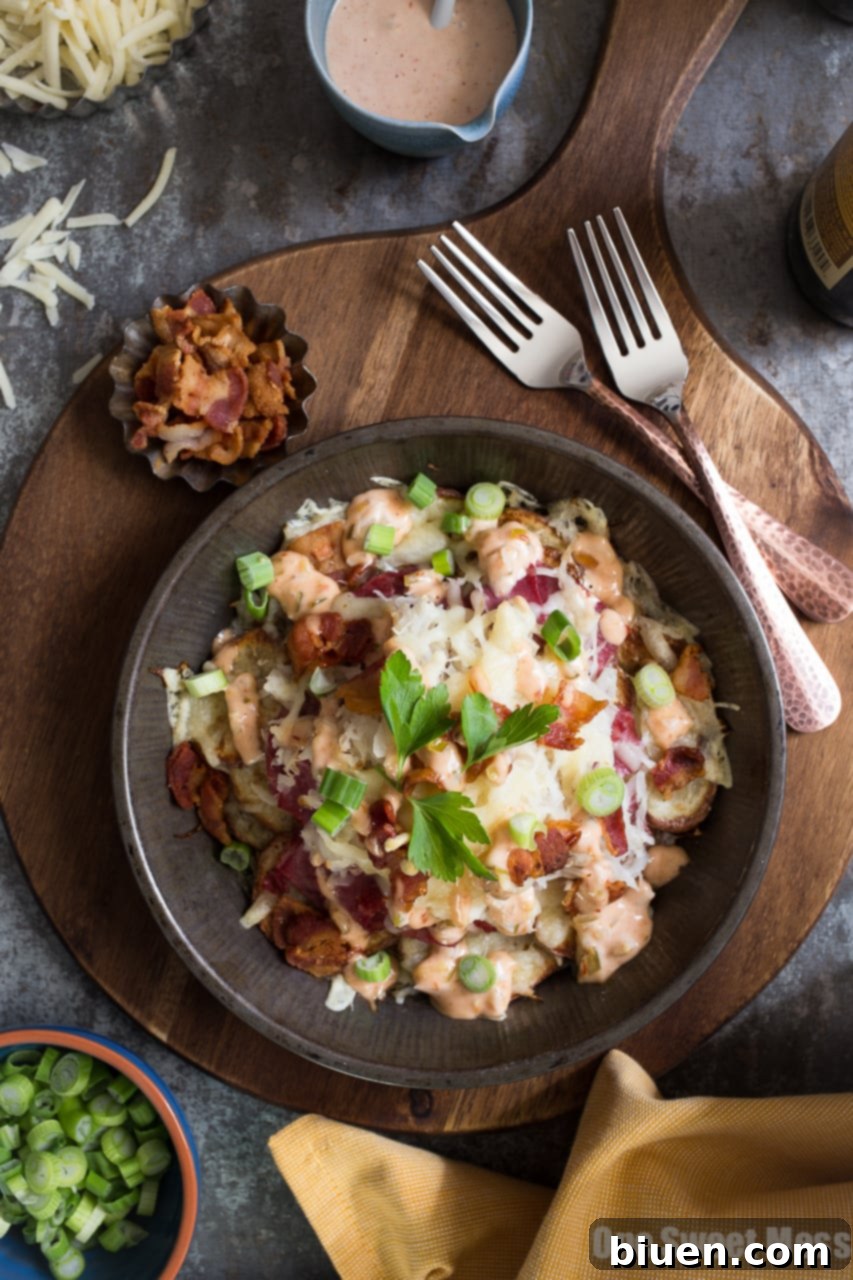 Loaded Reuben Irish Nachos 2 Reuben Irish Nachos - Crispy potatoes with corned beef, Swiss cheese, and sauerkraut