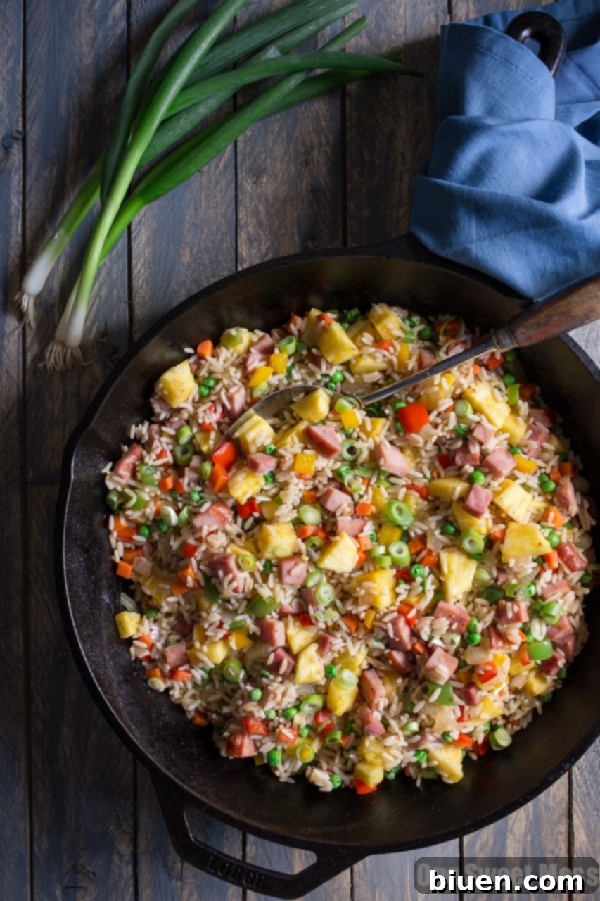 Pineapple Ham Fried Rice, a vibrant dish with ham, rice, and fresh pineapple