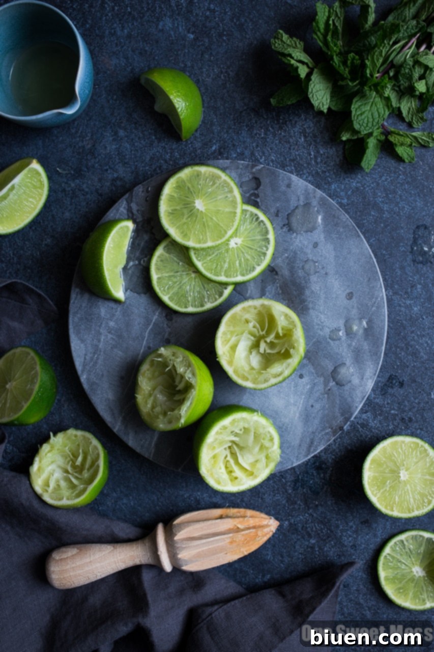Close-up of a refreshing Pineapple Cranberry Mojito with ice and vibrant colors