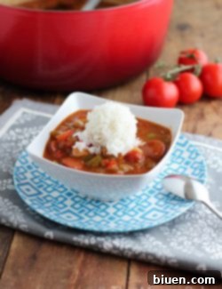 Final plated Chicken & Andouille Sausage Jambalaya with a garnish of green onions.