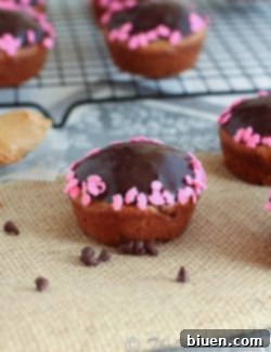 Finished Chocolate Glazed Peanut Butter Banana Muffins on a cooling rack