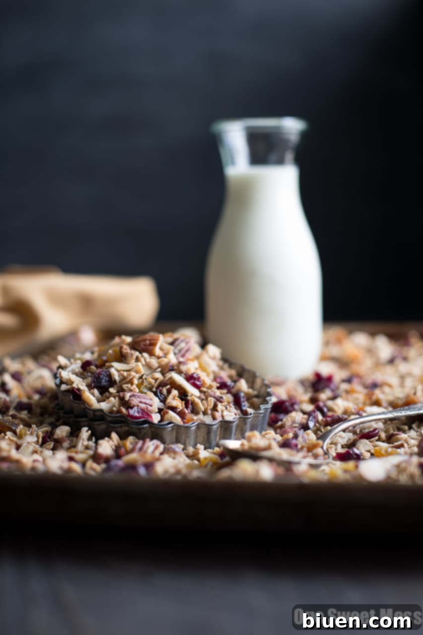 Close-up of golden brown Chai Spiced Granola on a baking sheet