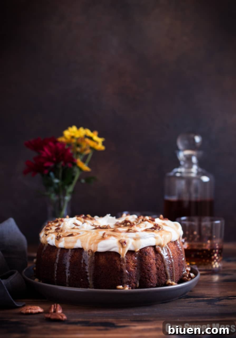 Sweet Potato Bundt Cake with Marshmallow Frosting and Bourbon Pecan Caramel Drizzle