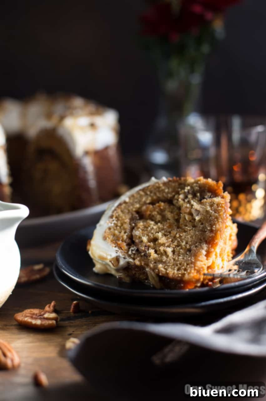 Sweet Potato Bundt Cake with Marshmallow Frosting and Bourbon Pecan Caramel Drizzle