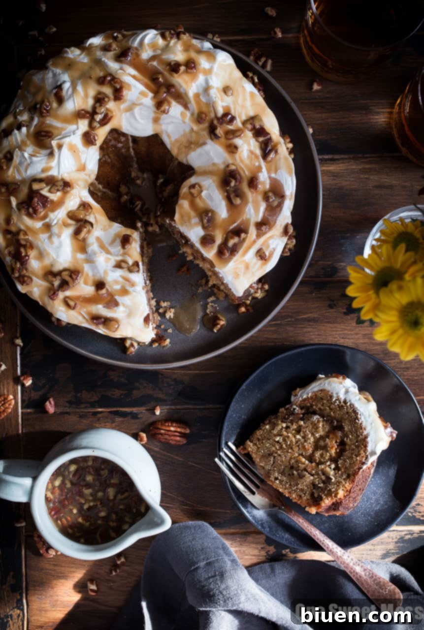 Sweet Potato Bundt Cake with Marshmallow Frosting and Bourbon Pecan Caramel Drizzle