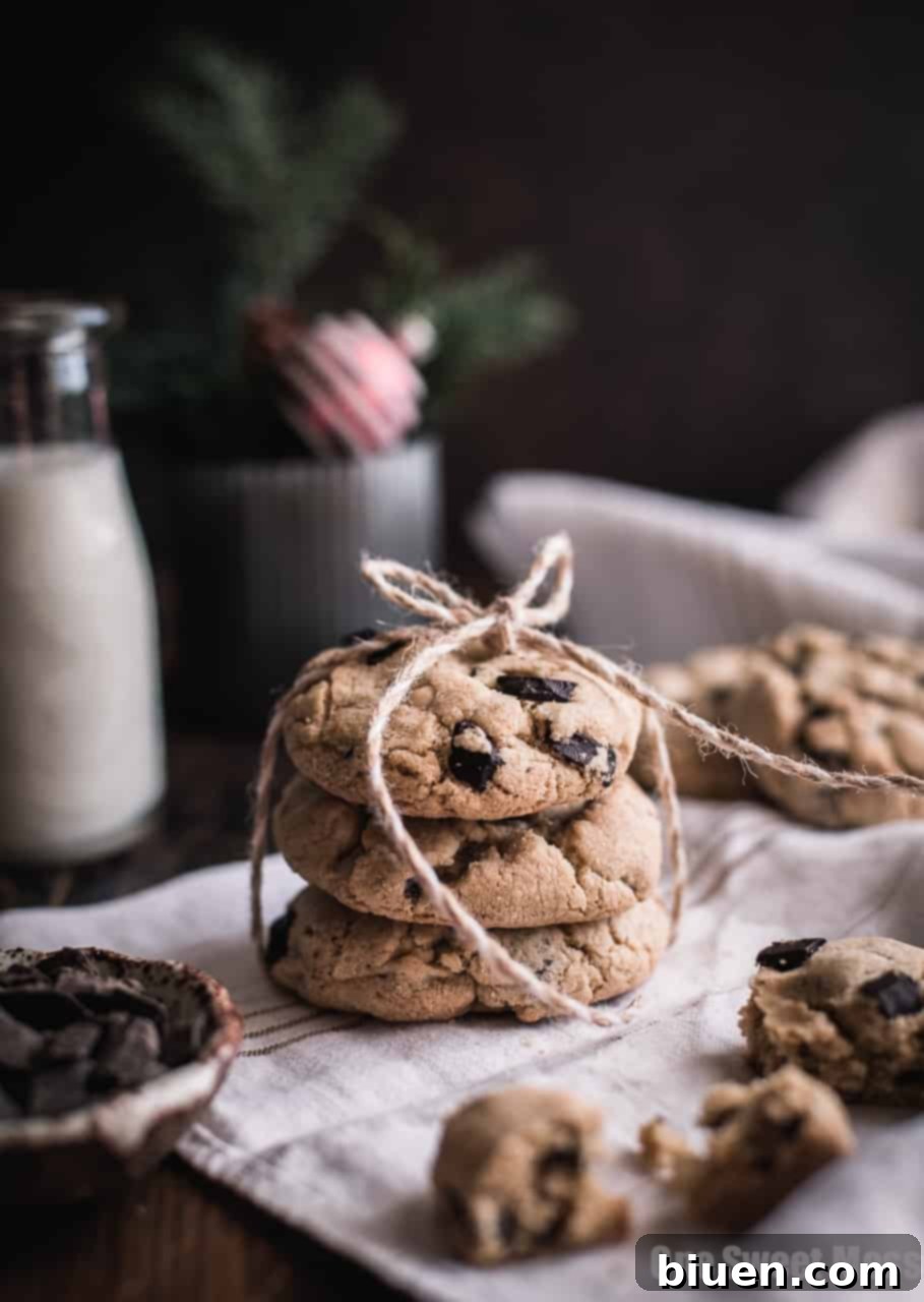 A plate full of freshly baked Gluten-Free Brown Butter & Toasted Almond Chocolate Chunk Cookies