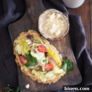 Gluten-Free Greek-Inspired Naan Pizza 8 Gluten-Free Greek Salad Naan Pizza: Gluten-Free Naan smeared with creamy hummus and topped with a mound of fresh Greek salad.