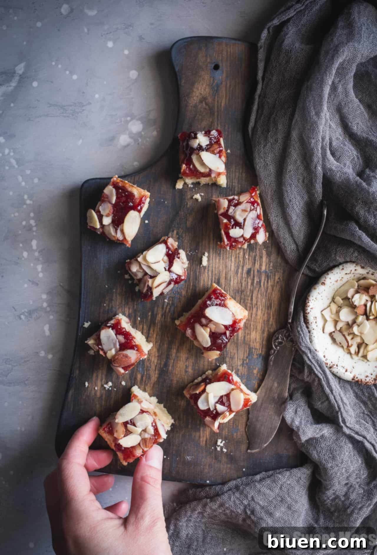 Several Gluten-Free Cherry Almond Shortbread Bars arranged artfully