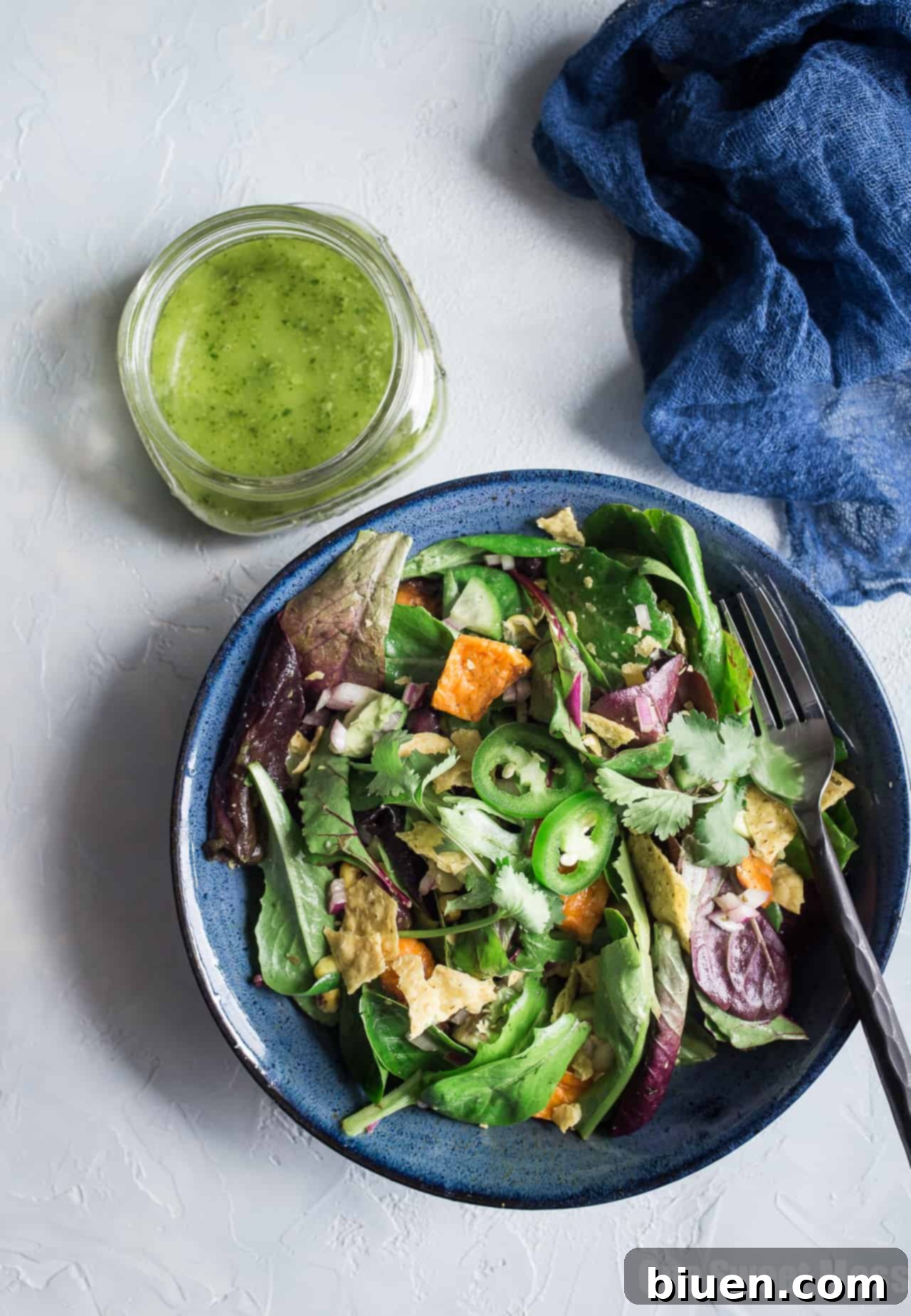 Vibrant Roasted Sweet Potato and Black Bean Salad with Chili Lime Vinaigrette, showcasing fresh ingredients and creamy avocado