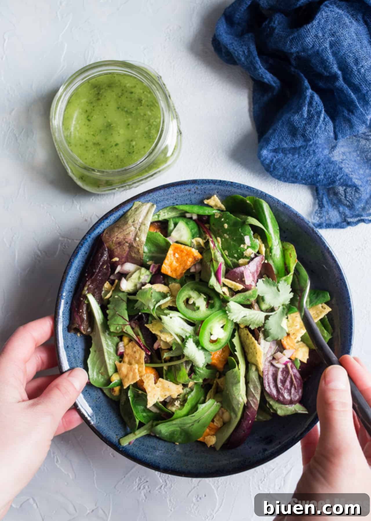 Close-up of a bowl of Roasted Sweet Potato and Black Bean Salad, highlighting the roasted sweet potatoes and black beans