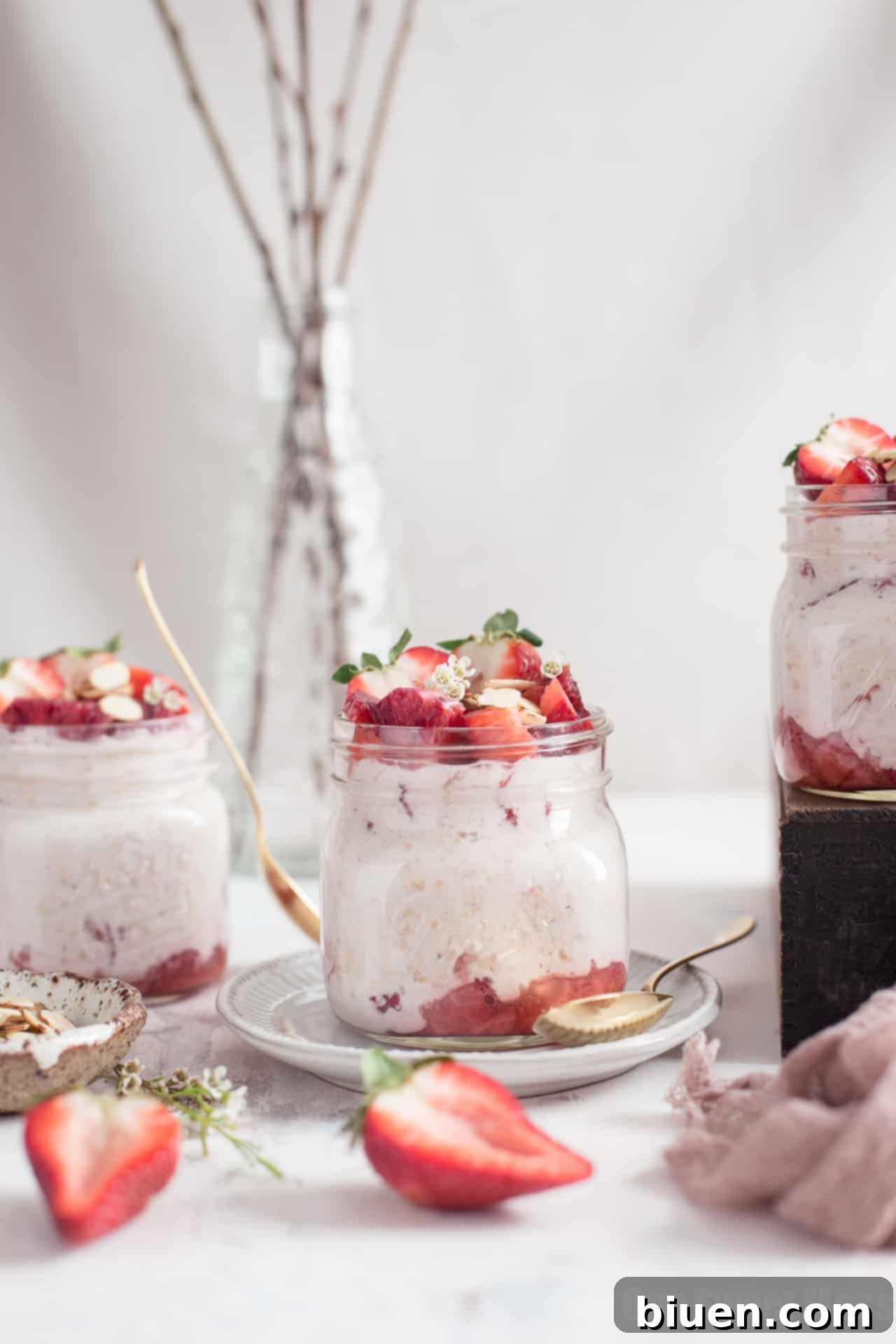 Individual jars of Strawberries and Cream Overnight Oatmeal, ready for meal prep