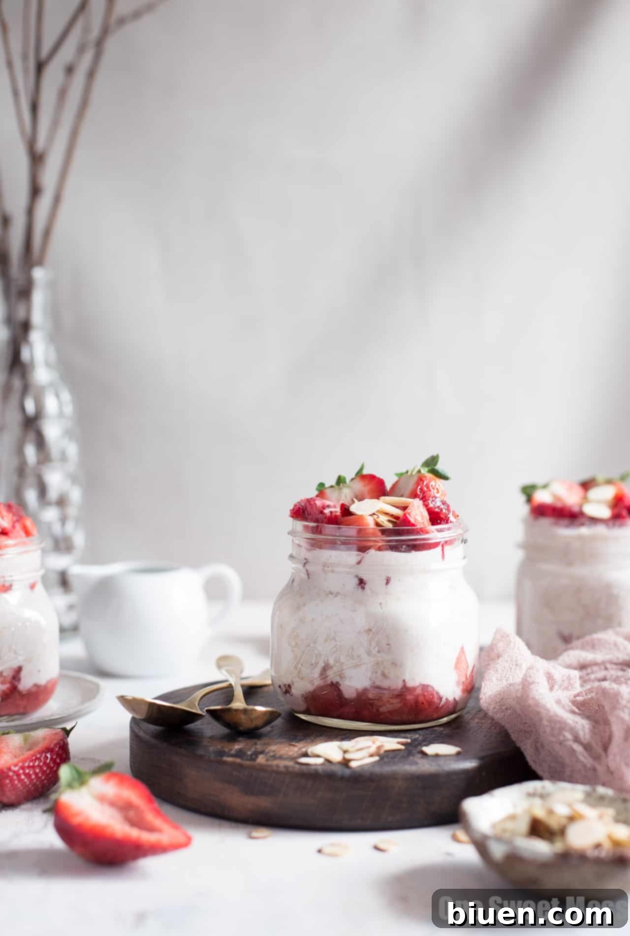 Close-up shot of Strawberries and Cream Overnight Oatmeal topped with toasted almonds