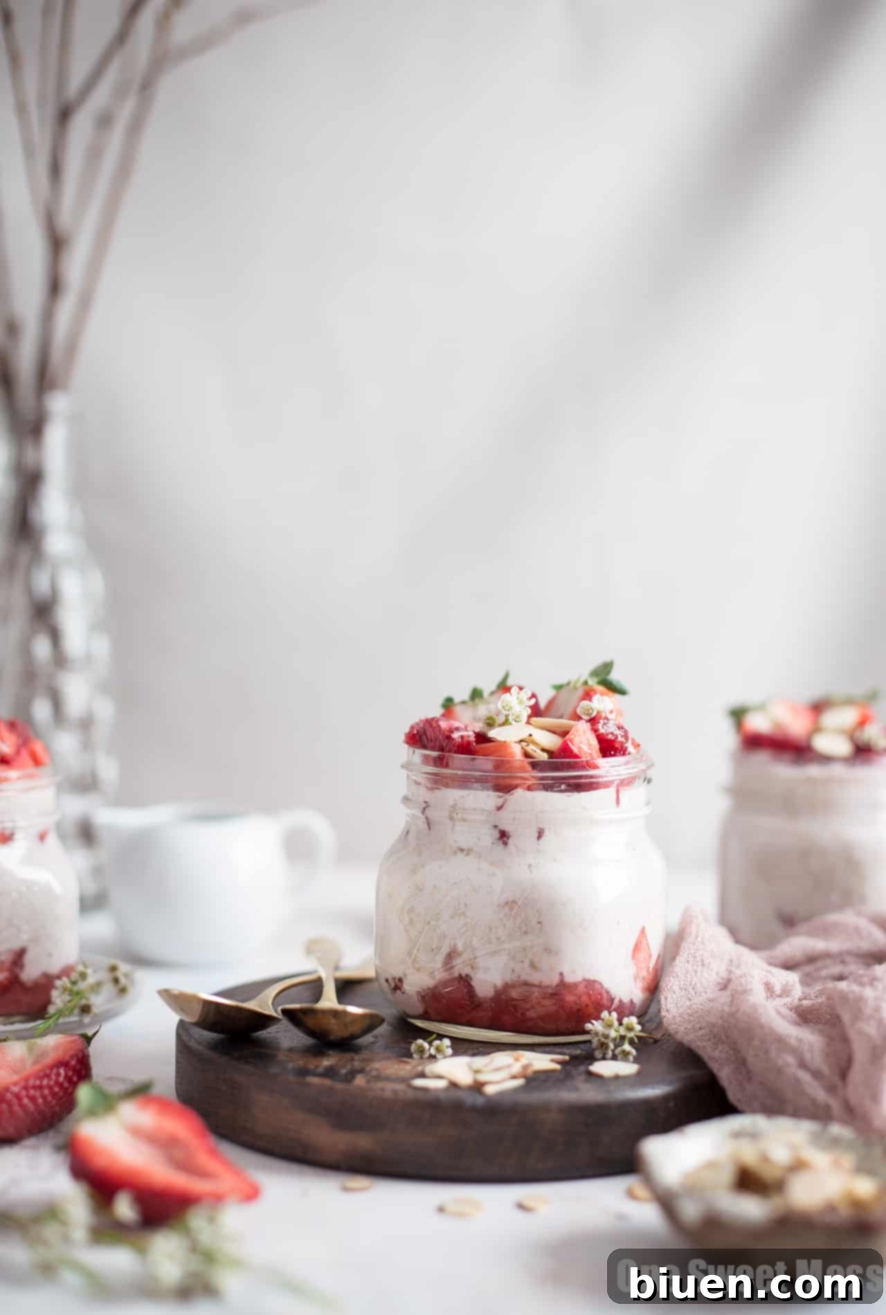 Overnight oatmeal with strawberries and cream, featuring fresh fruit and healthy ingredients