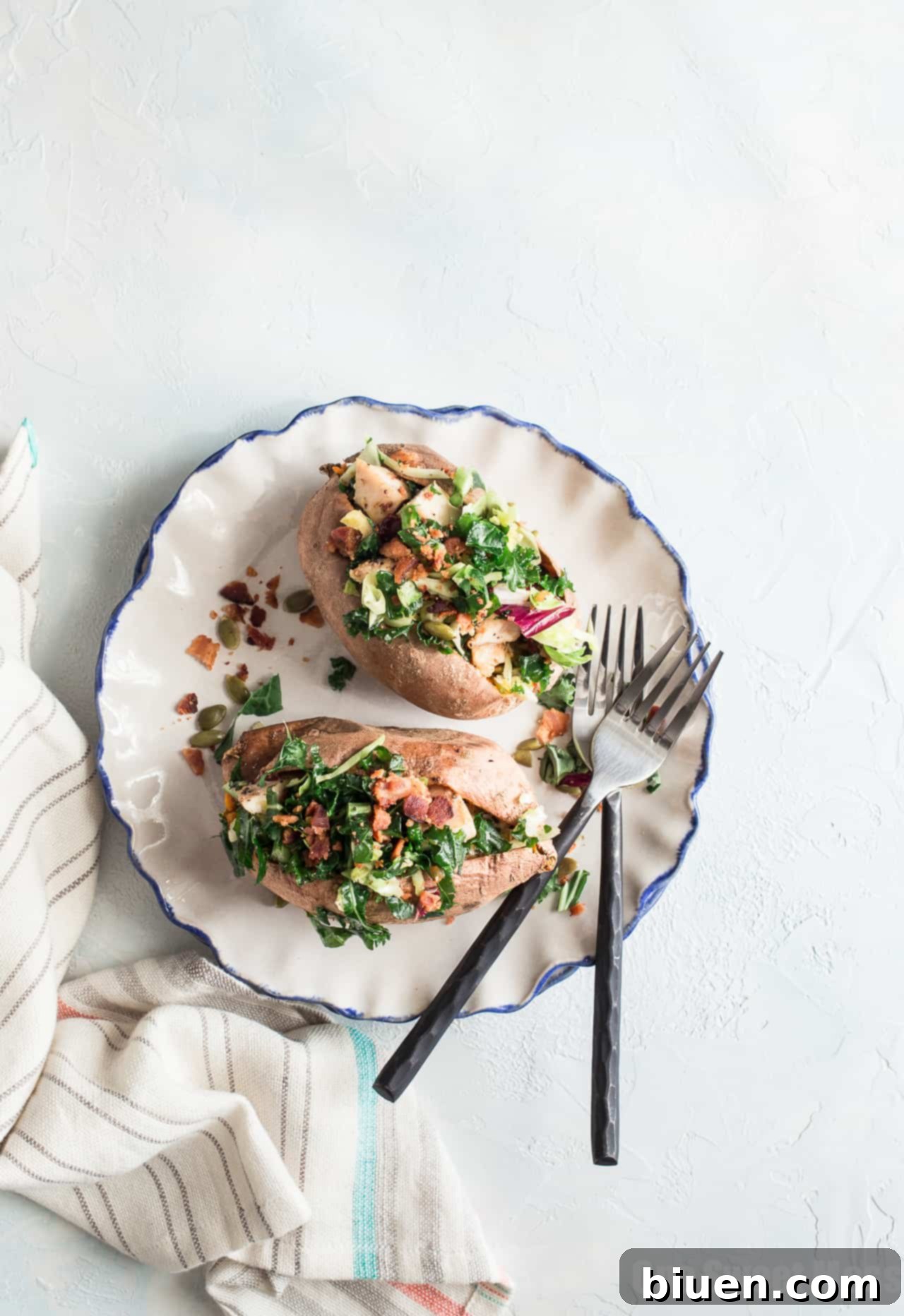 Finished grilled chicken and sweet kale salad stuffed sweet potatoes ready to serve