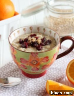 A prepared bowl of Orange Scented Steel Cut Oats, ready to be served, showing the creamy texture and potential toppings.