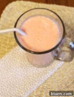A glass of Pineapple Upside Down Cake Smoothie