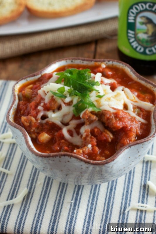 Preparing the Slow Cooker Pizza Dip ingredients before cooking, showcasing fresh vegetables.