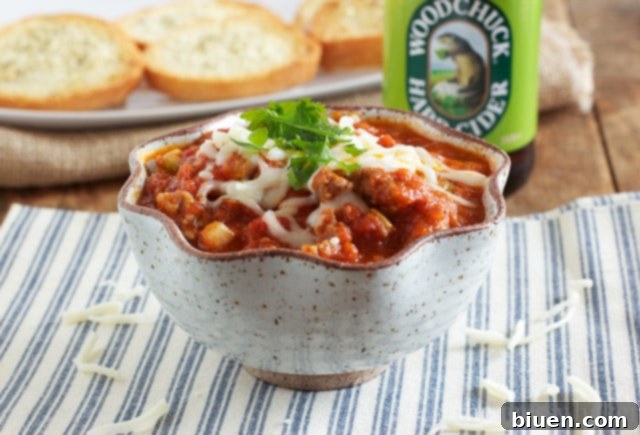 A close-up of the Slow Cooker Pizza Dip, showcasing the creamy, cheesy texture and savory ingredients.