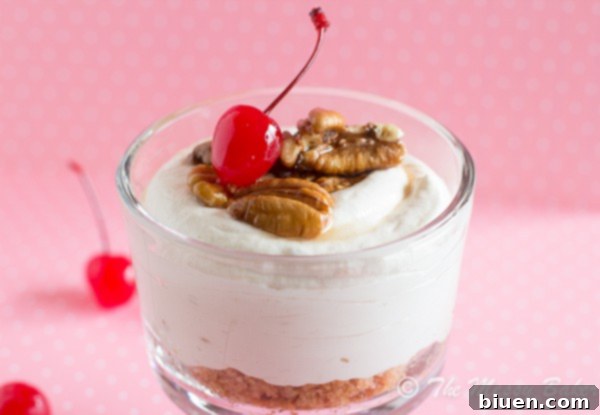 Individual serving of No-Bake Banana Sundae Cheesecake in a charming glass, showing creamy texture