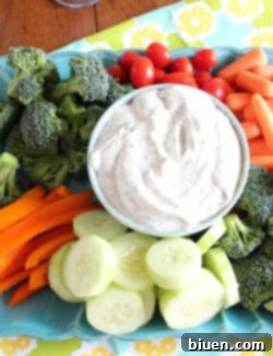 Creamy Dill Dip in a bowl with fresh dill garnish.