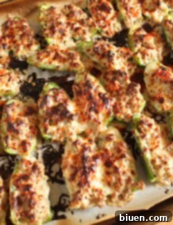 A perfectly baked stuffed jalapeño, golden brown and delicious.