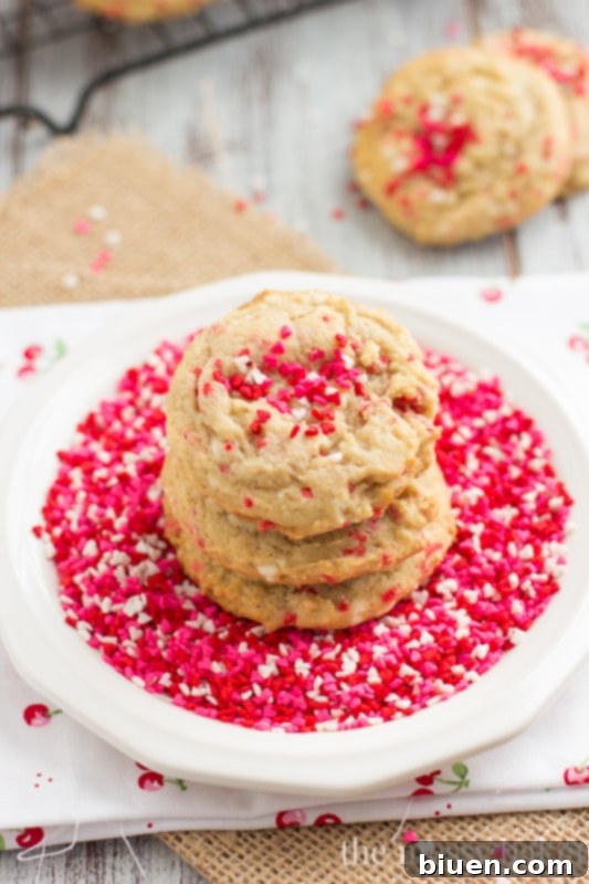 Hand holding a soft Cream Cheese Funfetti Cookie, emphasizing its perfect texture.