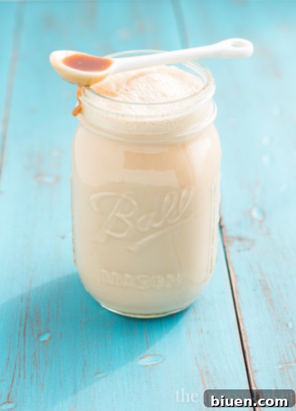 Homemade Caramel Macchiato Coffee Creamer poured into a cup of coffee